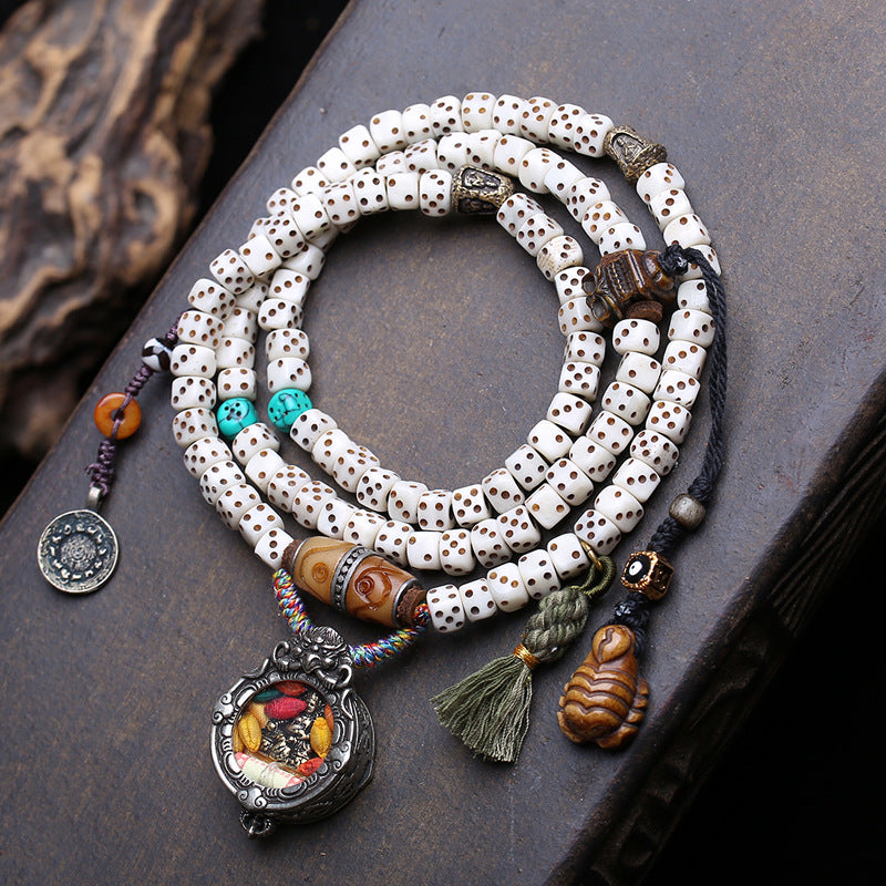 EverestArtstudios Dice-Carved Bone 108-Bead Mala with Ghau and Wealth Deity Pendants