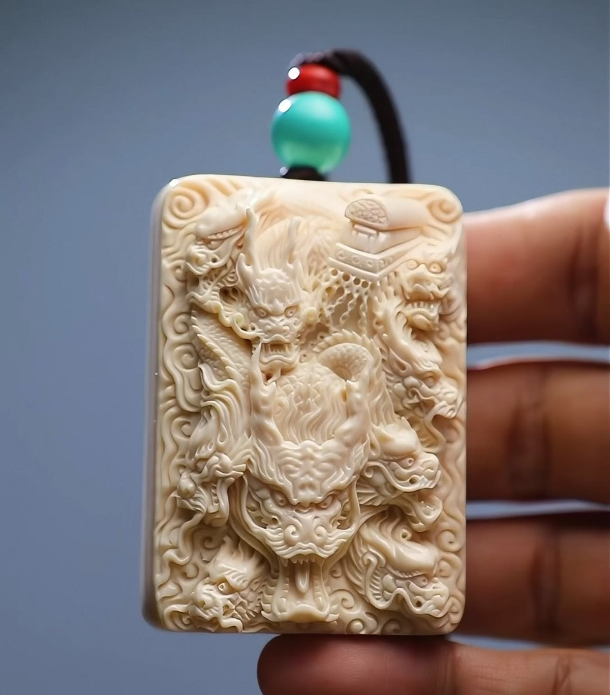 Load video: EverestArtStudios Natural Reclaimed Mammoth Ivory Nine Dragons Pendant, Hand Carved Dragon Amulet Necklace, Fortune Talisman Gift